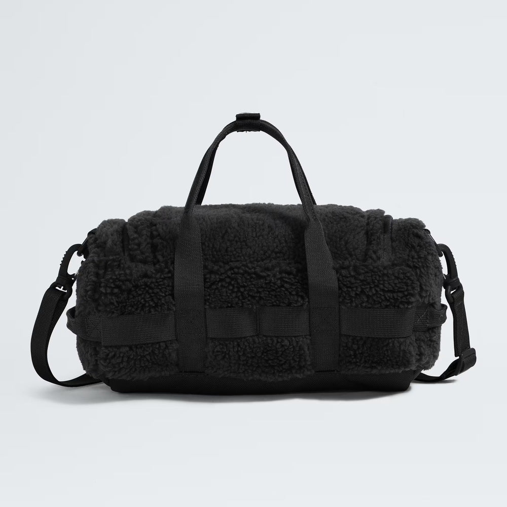 The North Face Base Camp High Pile mini bag in black fleece with top handles and detachable shoulder strap