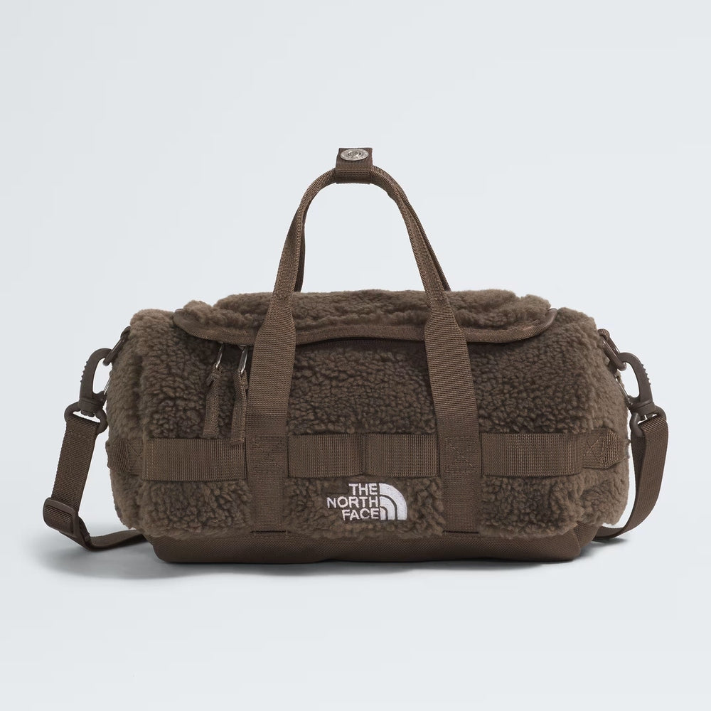 The North Face Base Camp High Pile mini bag in brown teddy fleece with top handles and adjustable crossbody strap