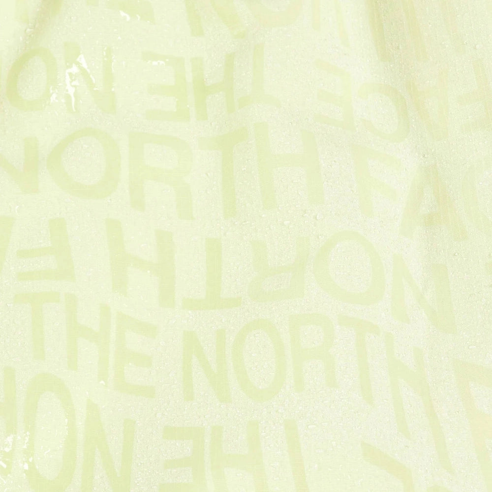 Repeating pattern of a brand name on a light yellow background