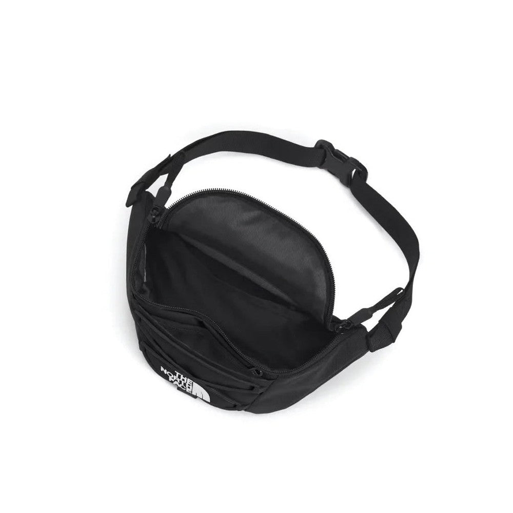 The North Face Jester Lumbar Bag in Black with open main compartment, front zip pocket, and adjustable strap.