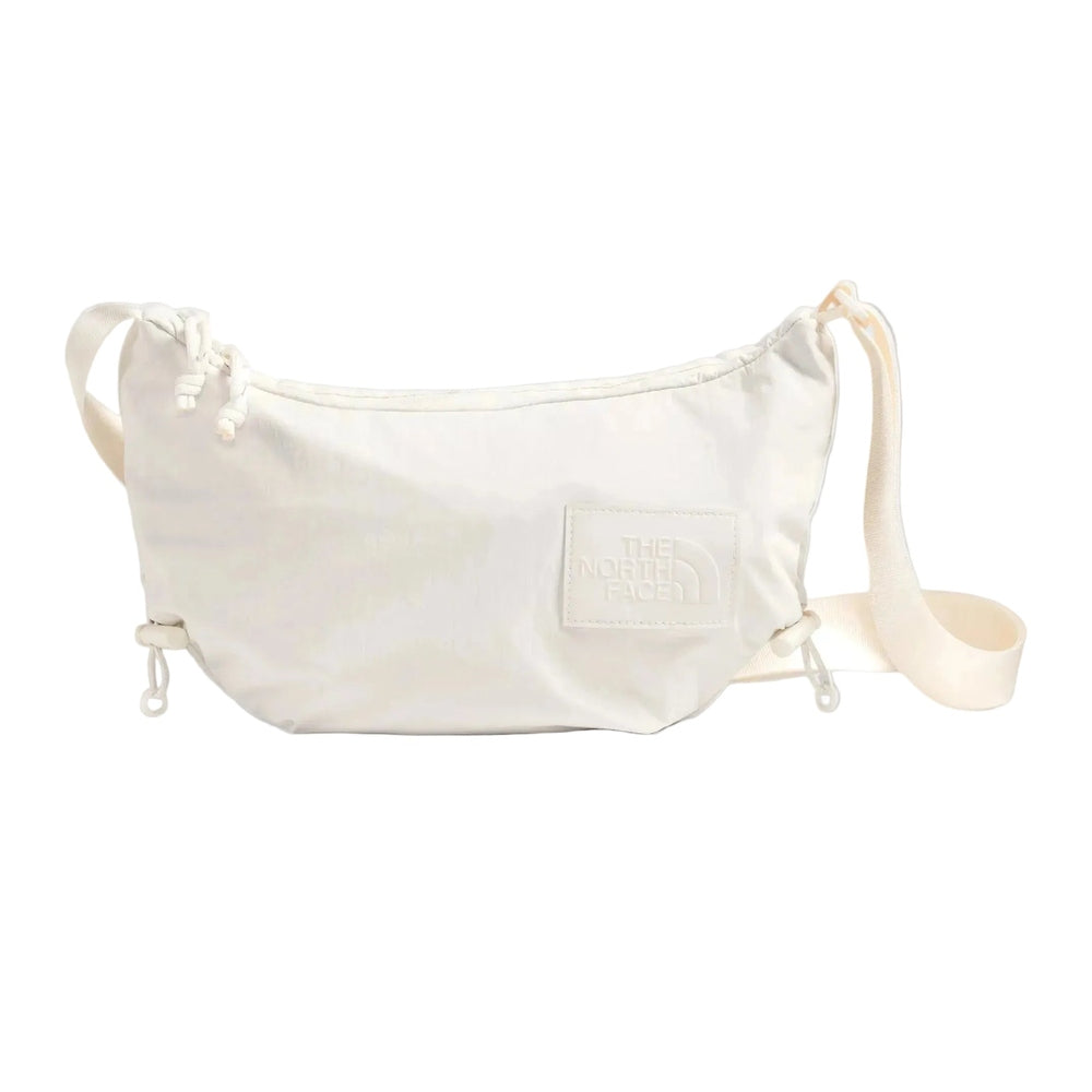 The North Face Never Stop Crossbody Bag in Cream, side view