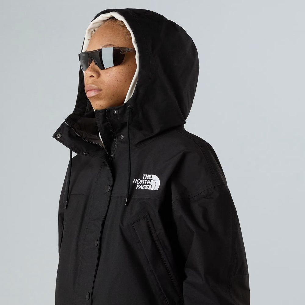 The North Face women’s black rain jacket with hood and chest logo.