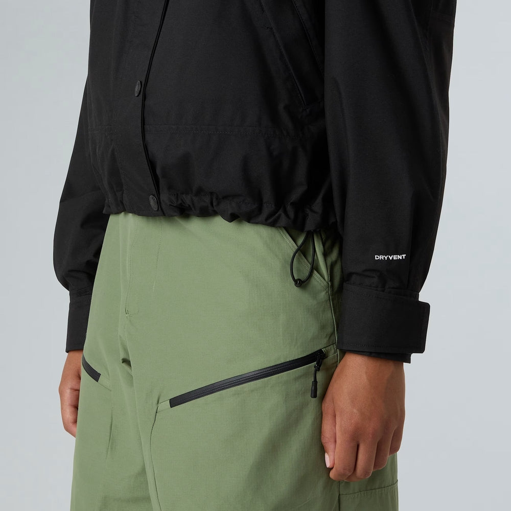 The North Face Women’s Reign On Jacket in black DRYVENT with snap front and elastic hem.