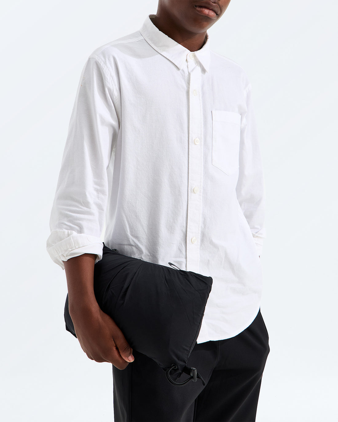 The North Face kids’ 1996 Retro Nuptse Vest stowed into its left hand pocket