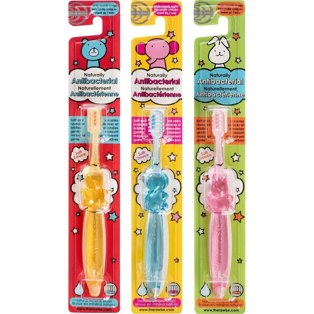 Thera Wise Crystal Animals antibacterial children's toothbrushes, 3-pack in red/yellow/green with animal handles and soft bristles.