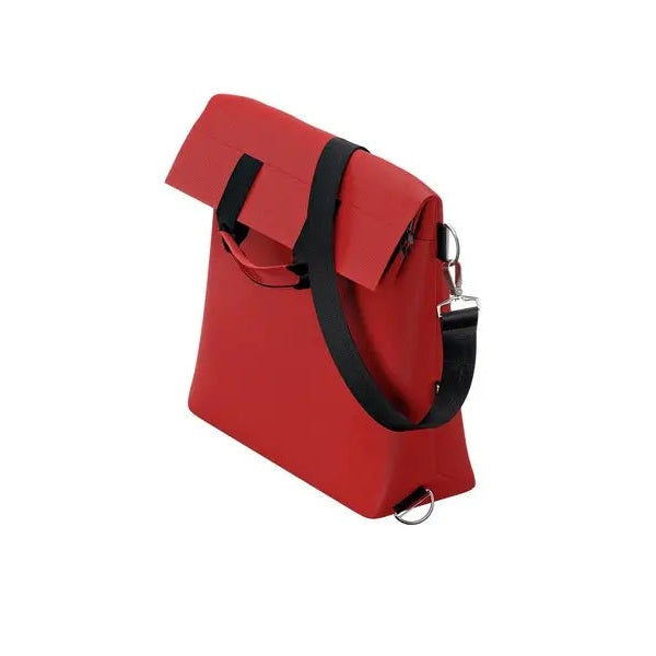 Thule Changing Bag red tote with black shoulder strap and metal hardware shown ready to grab on the go.