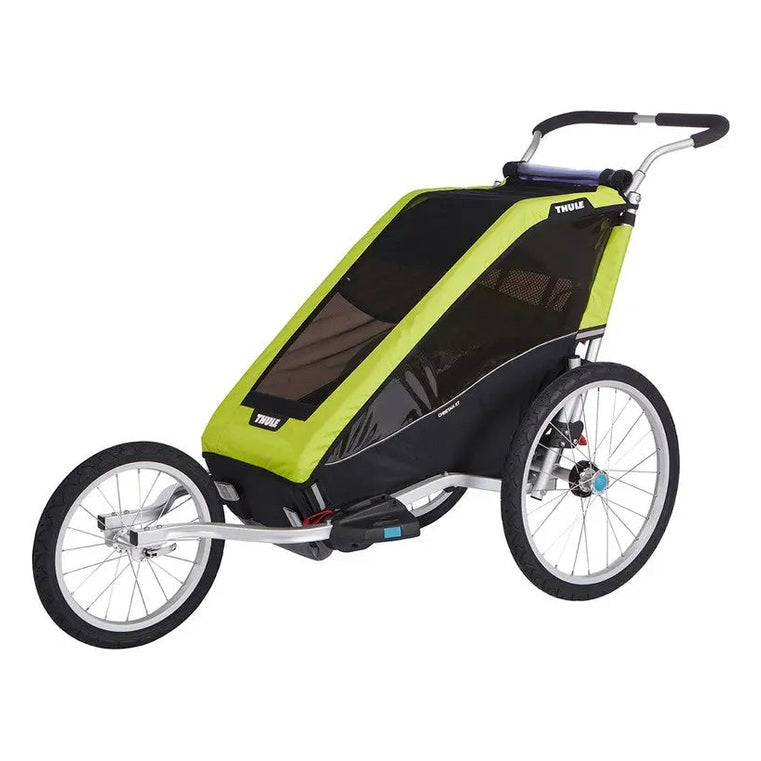 Thule Chariot Jogging Kit Cougar/Cheetah CX stroller trailer in lime-green with black mesh, being pushed by a parent.
