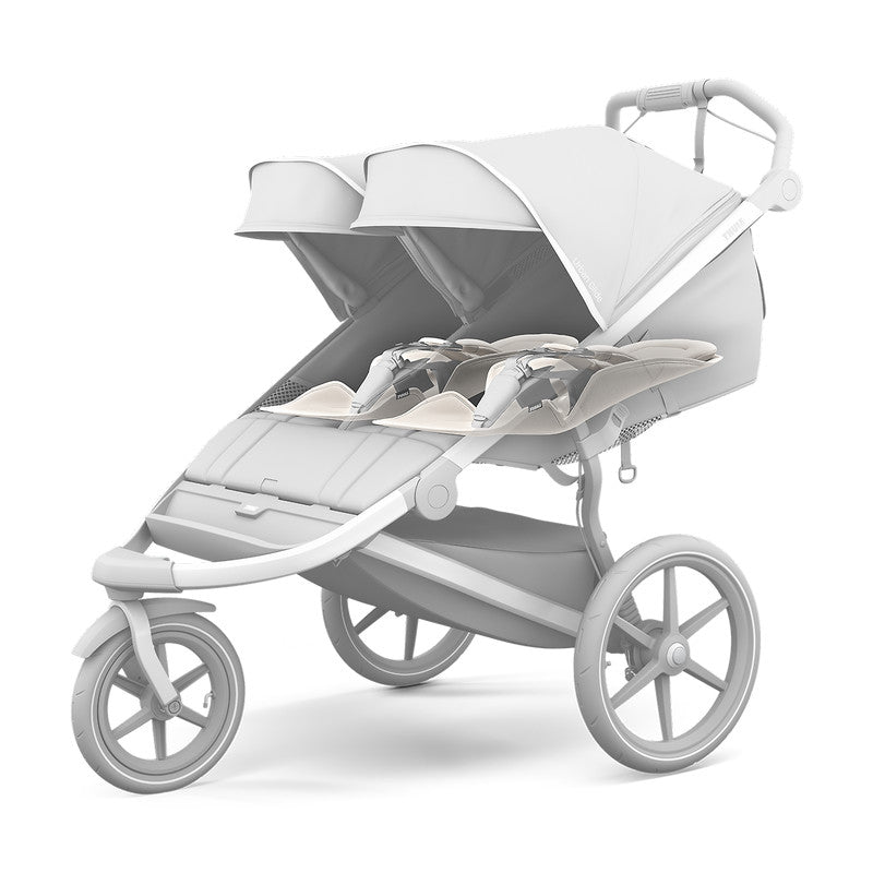 Thule Newborn Inlay Gray stroller accessory on a gray THULE stroller with double seats and canopies.