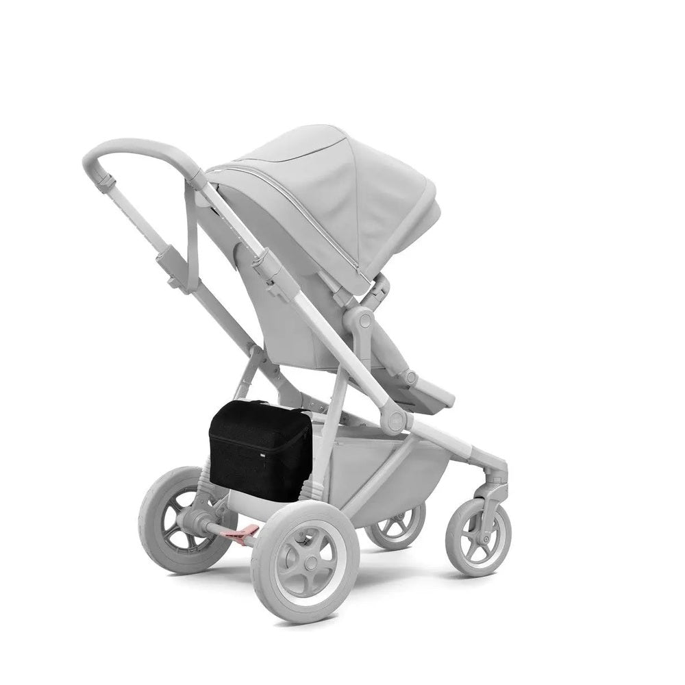 Thule Organizer attached under a light-gray stroller frame with a black storage bag, showcasing on-the-go organization.