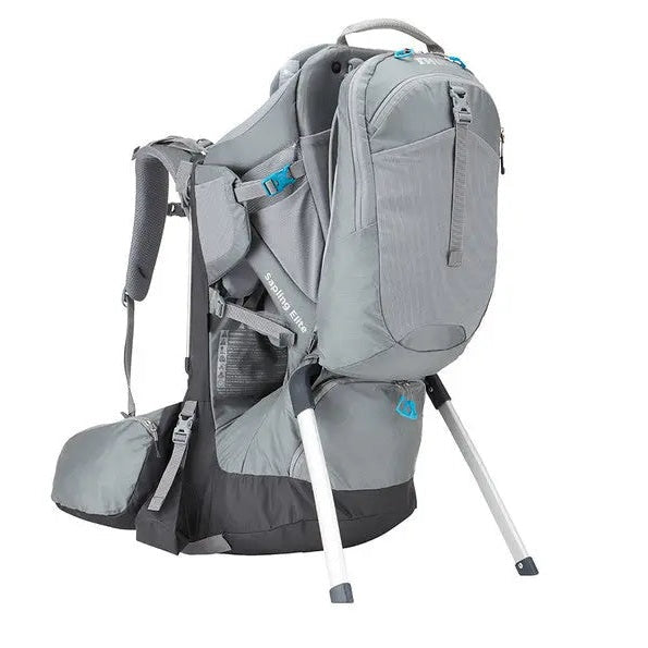 Thule Sapling Elite Child Carrier in grey with blue accents, stand legs extended for stable setup.