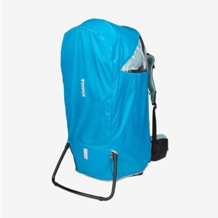 Thule Sapling Rain Cover shields a stroller; bright blue with side pocket, slipping over the frame.