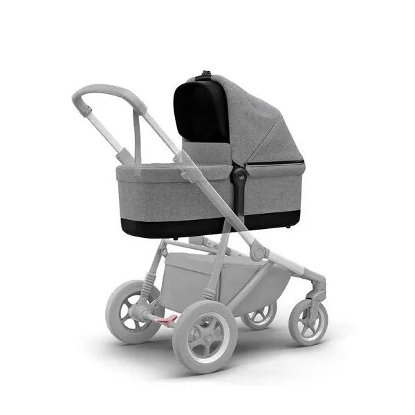 Thule Sleek Bassinet mounted on a gray stroller chassis, newborn bassinet with canopy.
