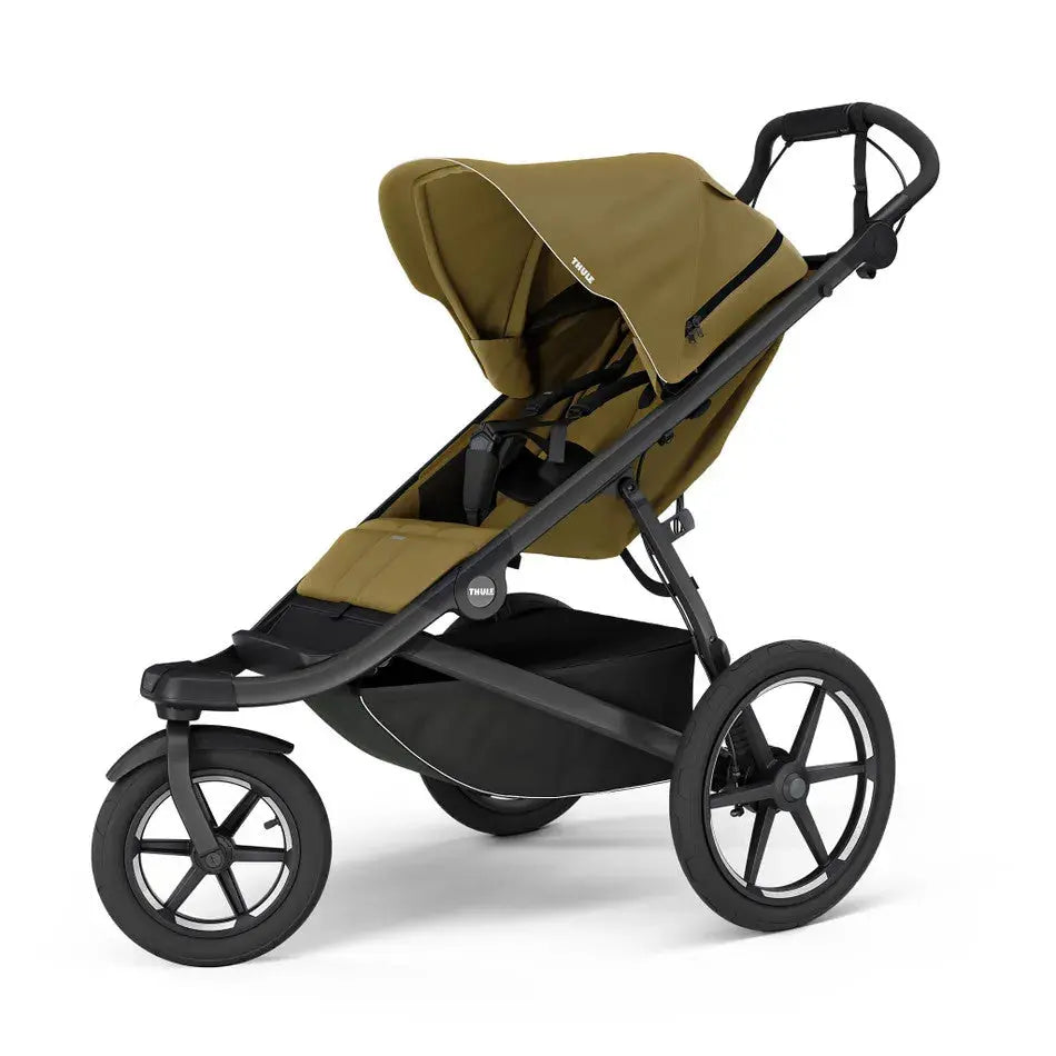 Thule Urban Glide 3 stroller in olive brown with black frame, showcasing a roomy seat and ready-to-push ergonomic handle.