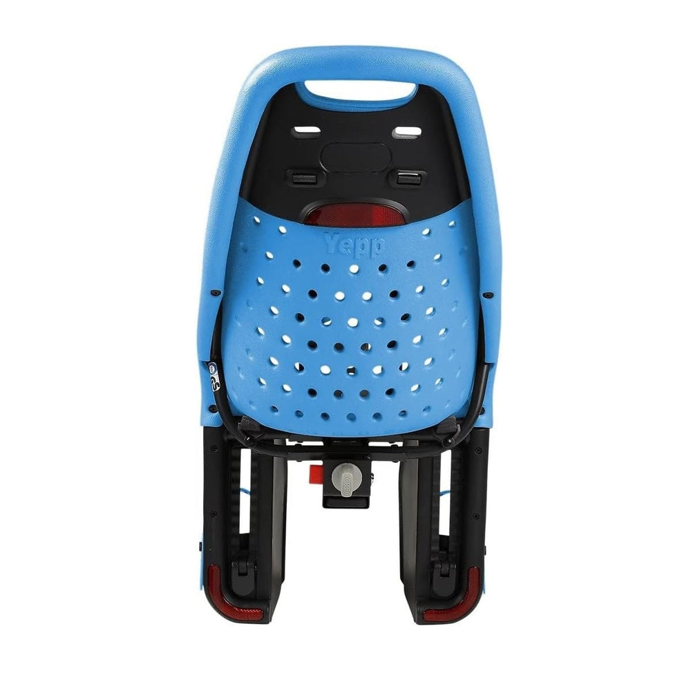 Thule Yepp Maxi rack-mounted child bike seat in blue, perforated shell shown securely attached to a rear rack