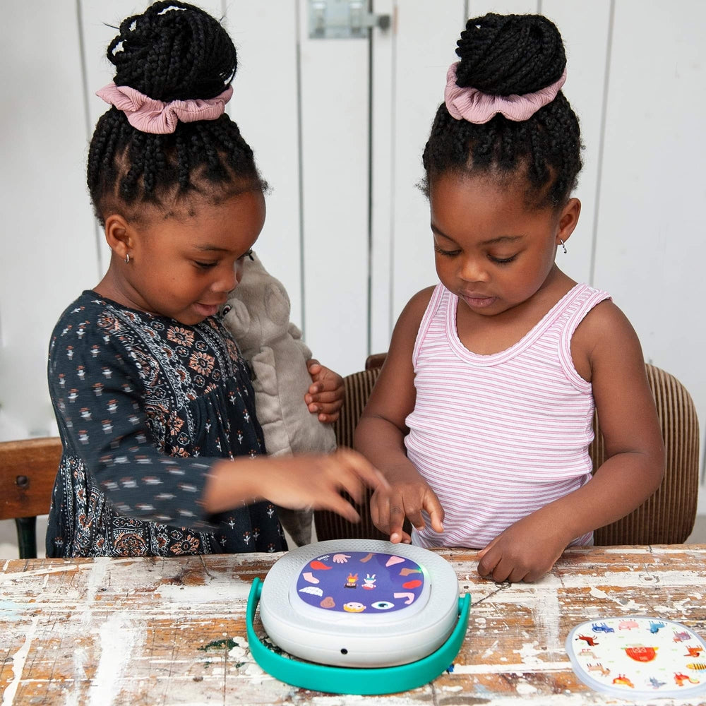 TIMIO Player Starter Kit; interactive music toy with teal base, two kids playing together.