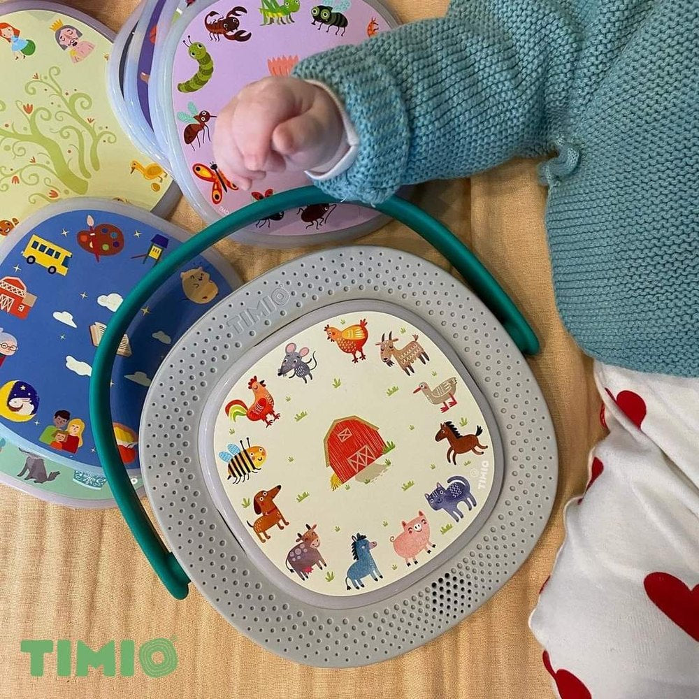 TIMIO Player Starter Kit with gray perforated speaker pad and 4 colorful animal-lid inserts for kids