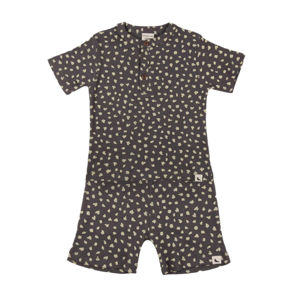 Turtledove London Animal Print Short Set Charcoal for babies, buttoned Henley top with cream-spotted shorts laid flat.