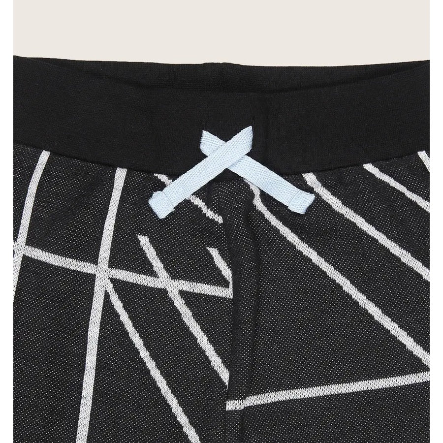 Turtledove London Geo Jacquard Harems, black with white geometric lines and a light-blue bow at the waistband.