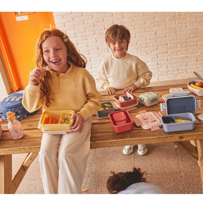 Tutete Kids Large Lunch Box set with colorful modular containers on a wooden table; two smiling children.