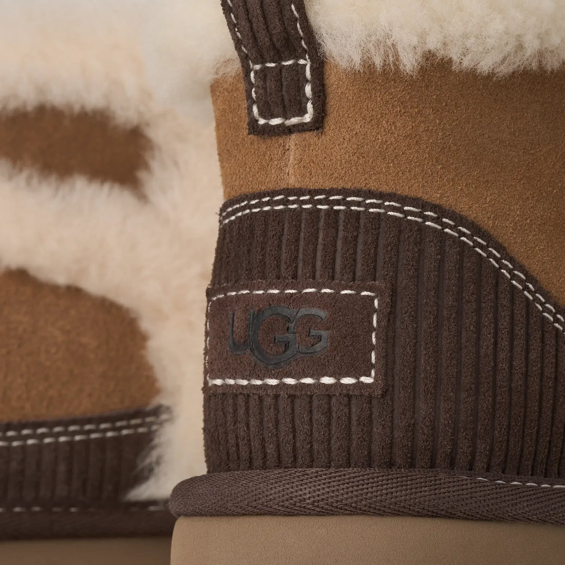 UGG Kids' Classic Mini II Heritage Chestnut sheepskin seam and heat-embossed UGG logo detail