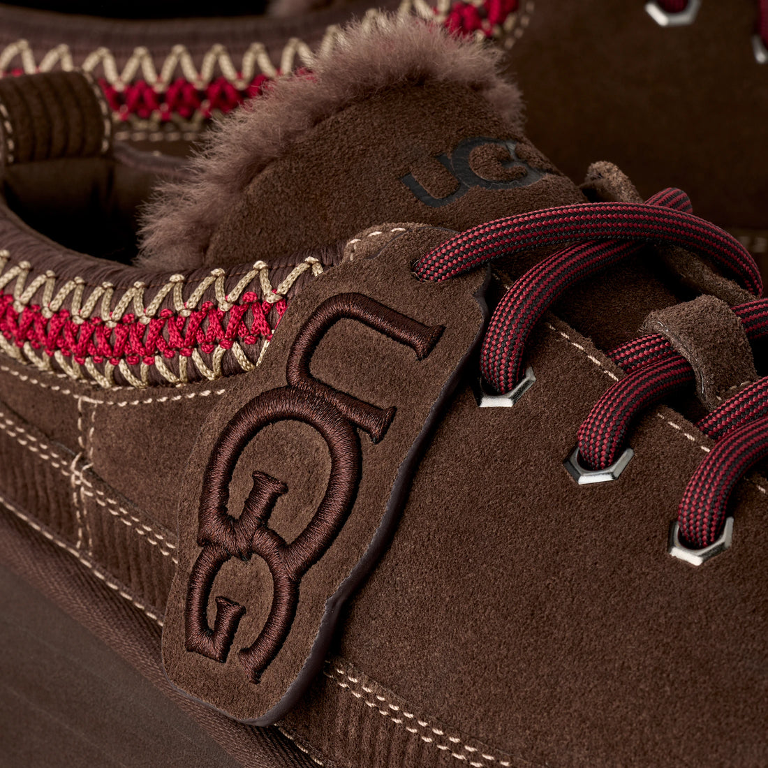 UGG Women's Heritage Lace-Up Slipper in Burnt Cedar, lace and logo detail view