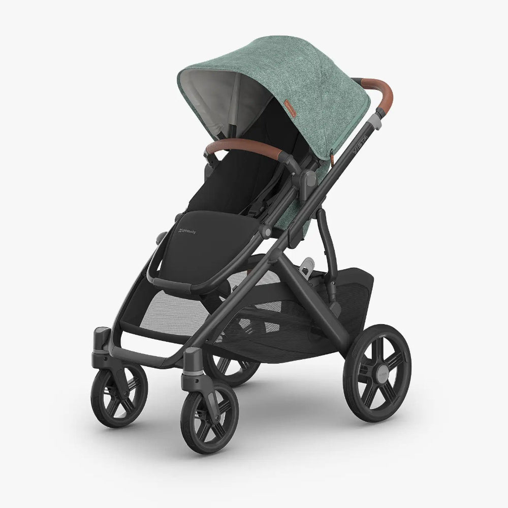 UPPAbaby Vista V3 stroller in Gwen fashion with black frame and brown leather handlebar.
