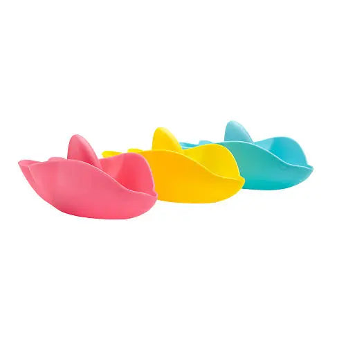 Ubbi Stack 'N Splash Bath Toys, 4 colorful pink, yellow, blue boat-shaped bath toys arranged for stacking.
