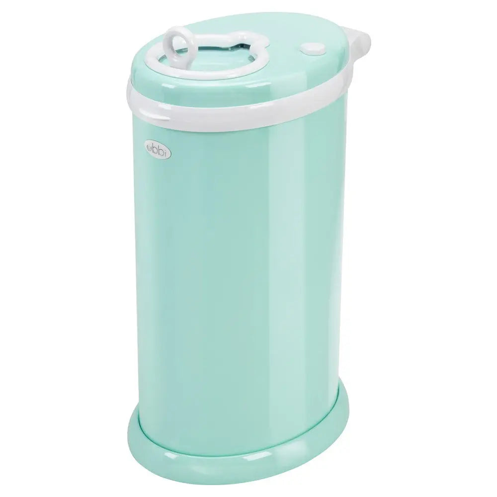 Ubbi Diaper Pail mint green with white lid and base, standing in a nursery