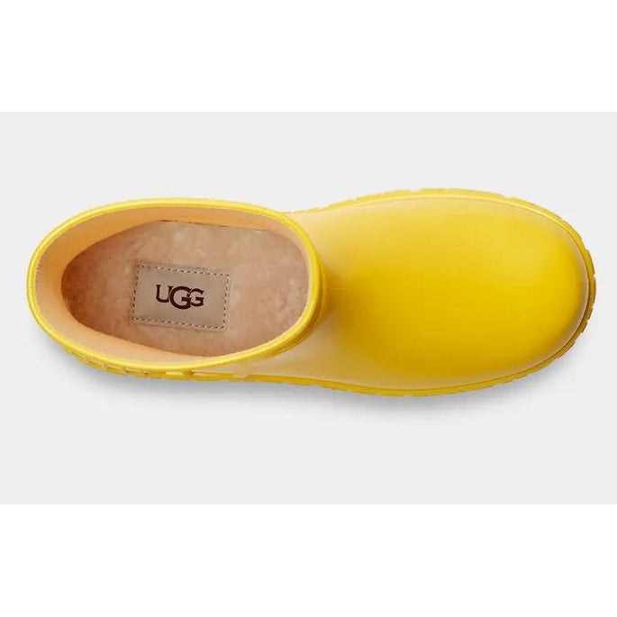 UGG Kid's Drizlita Canary rain boot; bright yellow with plush shearling lining visible inside.