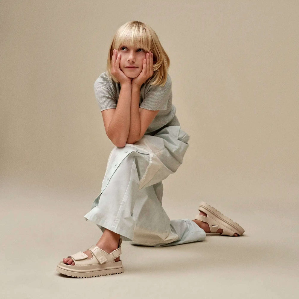 UGG Kids Goldenglow Sea Salt sandals with beige straps and chunky sole
