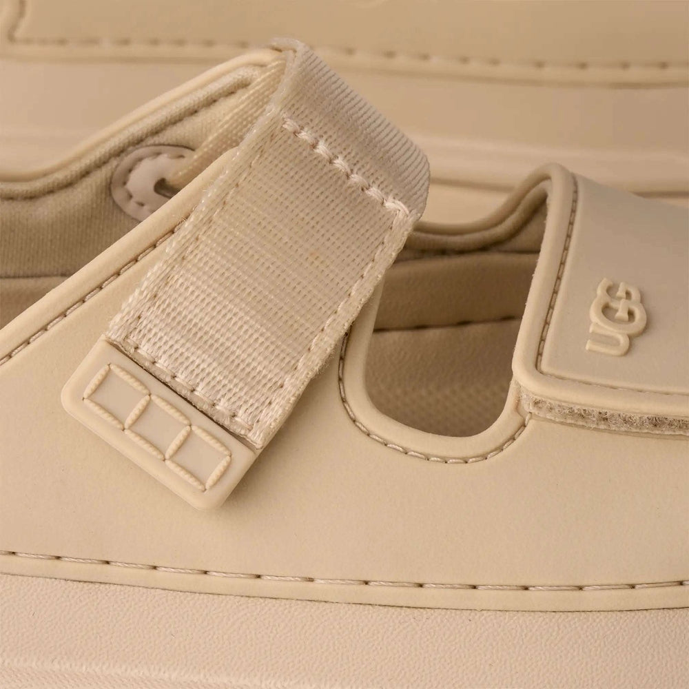 UGG Kids Goldenglow Sea Salt sandals with beige strap and Velcro closure
