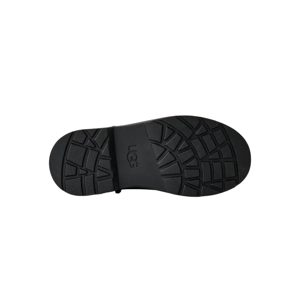 Bottom view of UGG Kids' Perry Weather Chelsea Black boot showing rugged tread and logo.