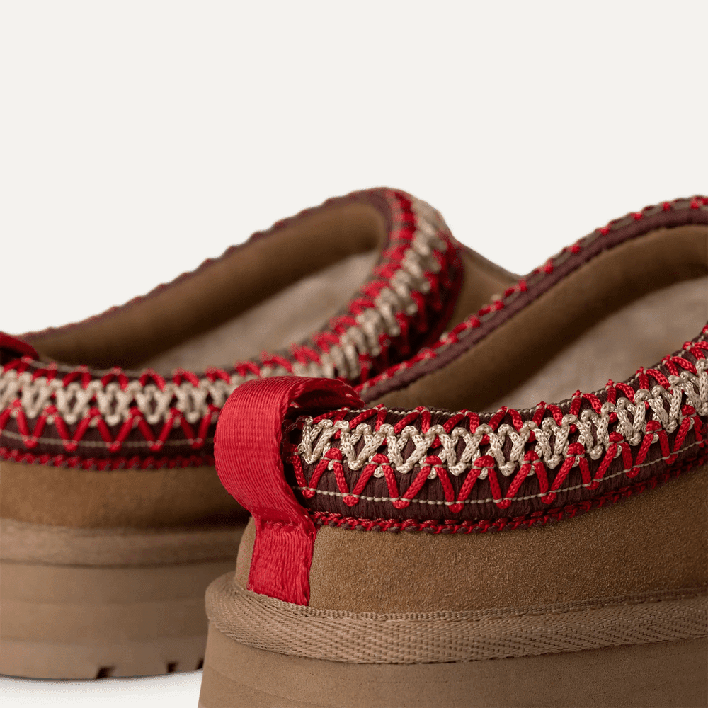 UGG Kids' Tazz Chestnut sandal, brown with red-stitched trim, featuring a red heel pull tab.