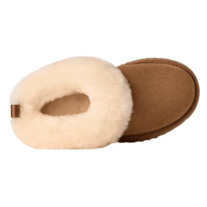 UGG Kids' Tazzelle Chestnut slippers with plush shearling lining, shown ready to slip on for warm steps.