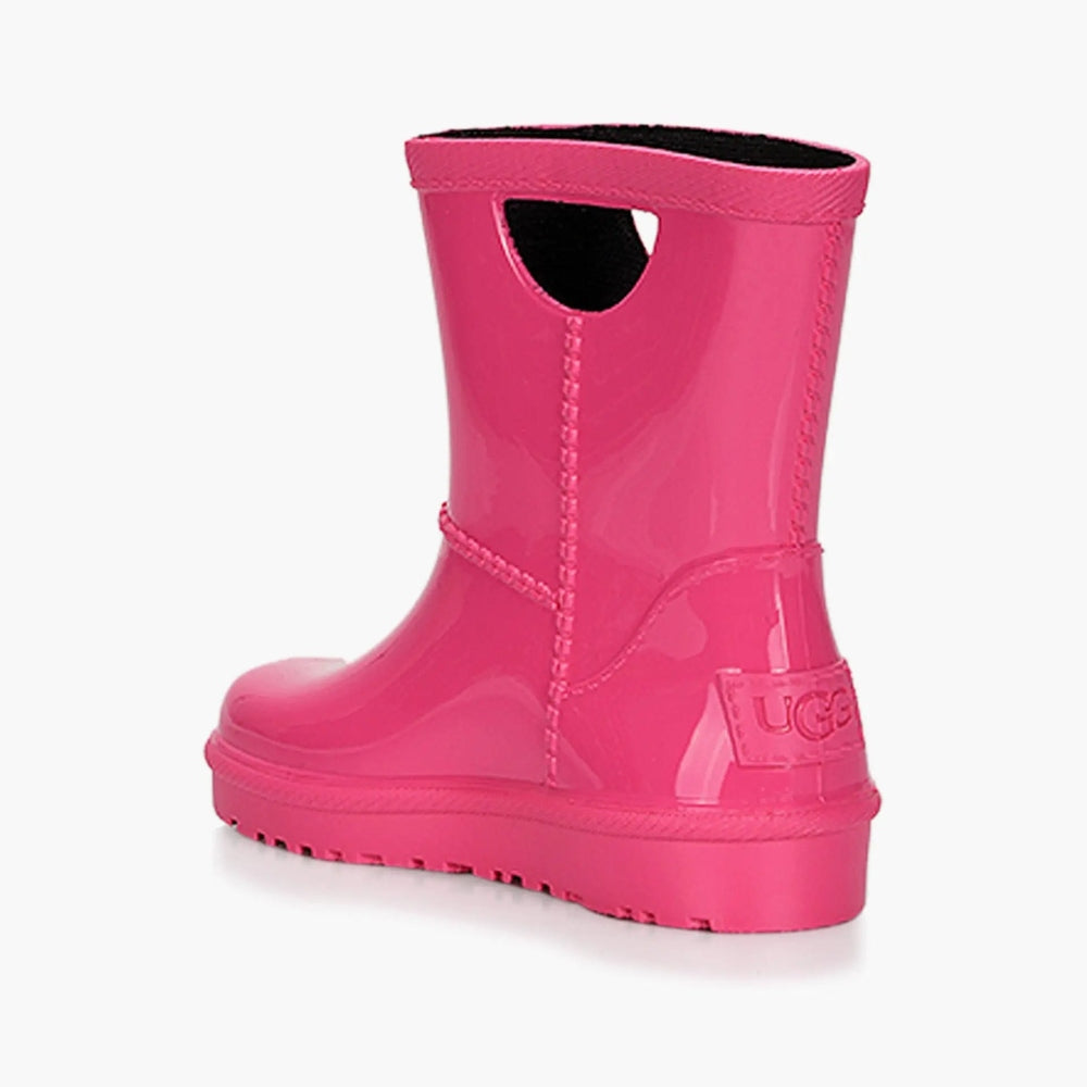 UGG Rahjee Rain Boot Pink, glossy pink rubber ankle boot shown from the back with rugged lug sole.