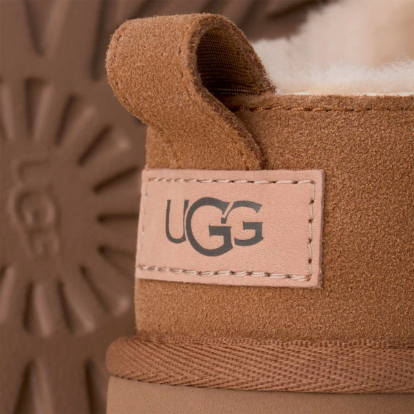 UGG Women's Classic Micro Chestnut boot; brown suede with plush lining and pull tab showing.