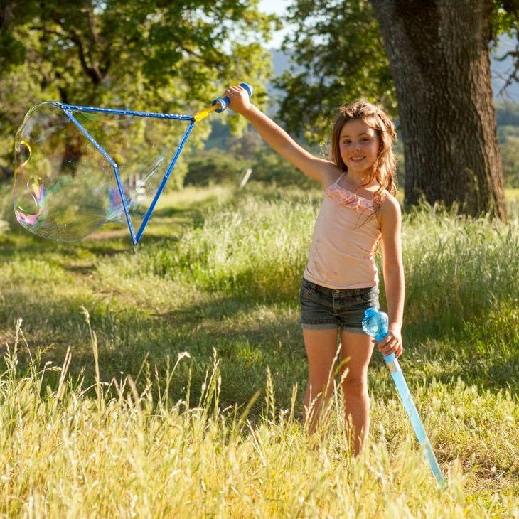 Uncle Bubble Giant Sword bubble wand, blue frame, 8 oz solution, girl outdoors