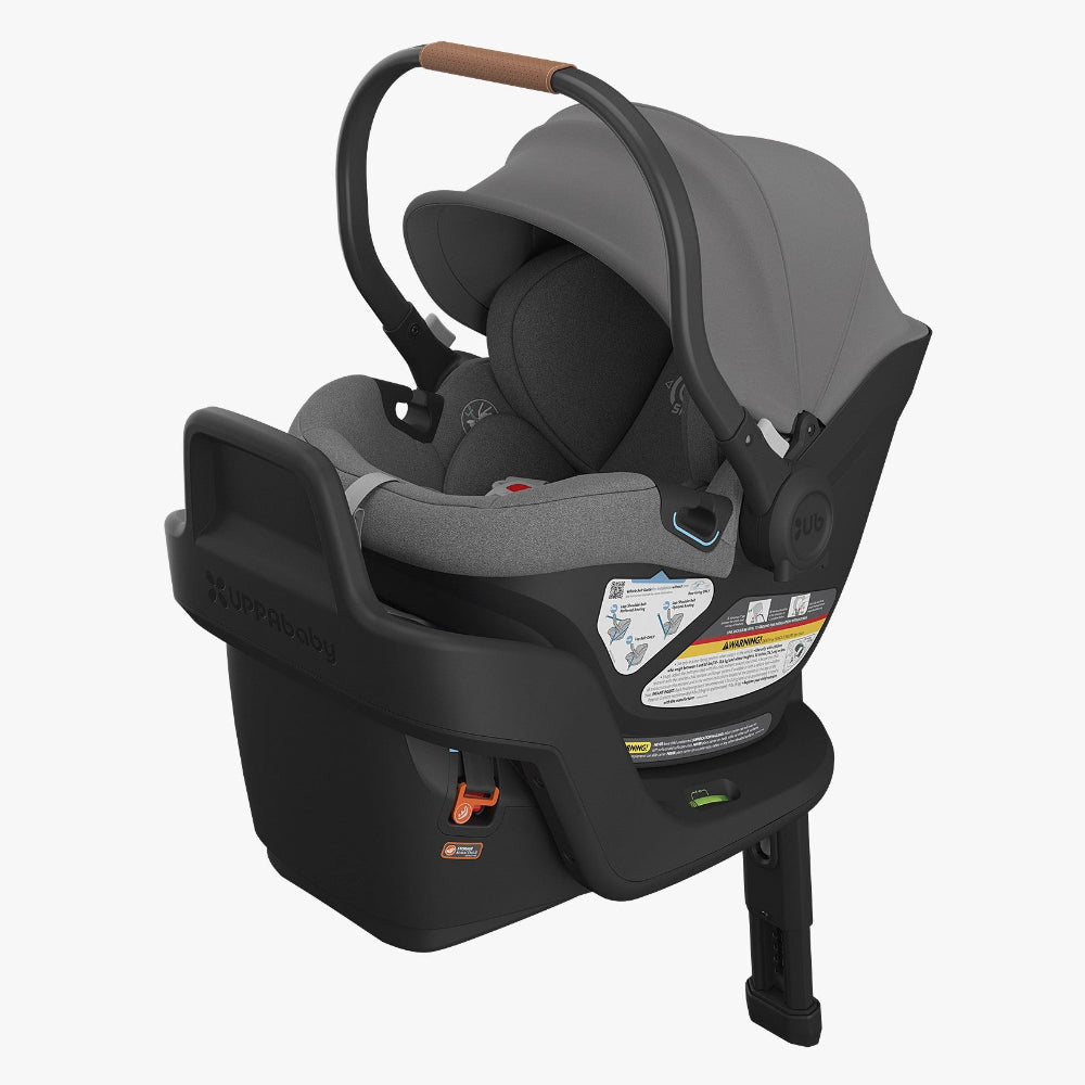 UPPABABY Aria Infant Car Seat in grey fabric with canopy and integrated base.