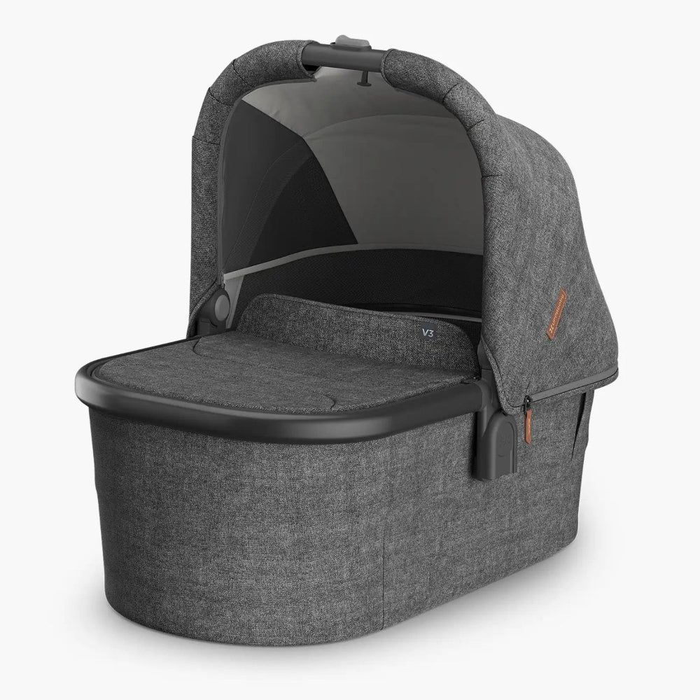 UPPAbaby Bassinet V3 in grey fabric with integrated canopy over a roomy bassinet base.
