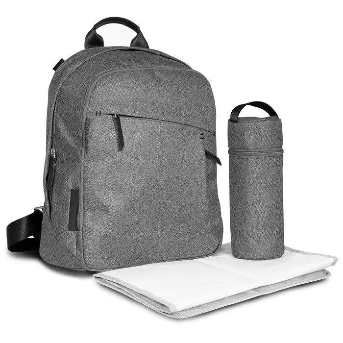 UPPABABY Changing Backpack in gray with bottle holder and foldable changing mat beside it