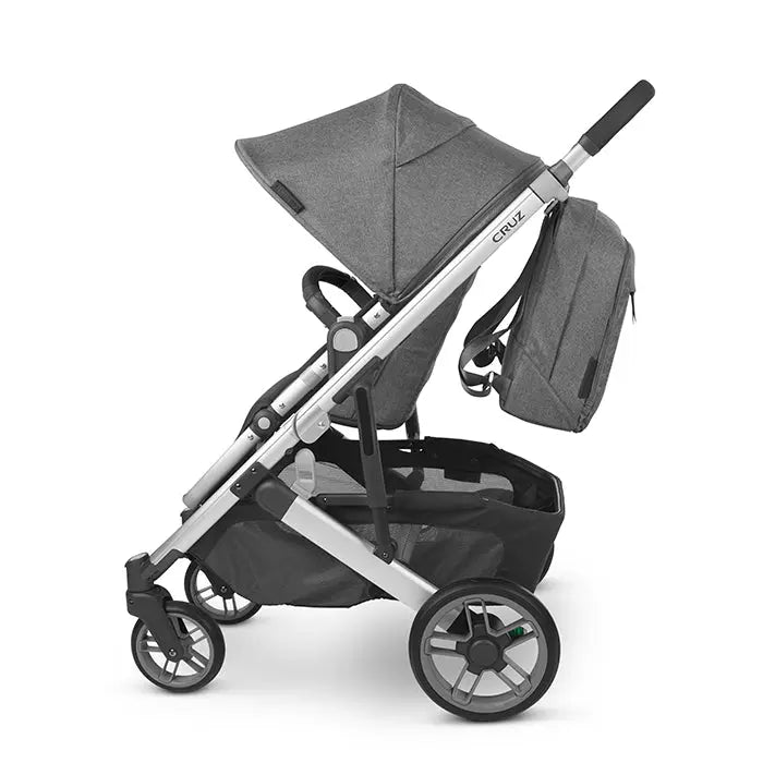 Uppababy Changing Backpack in grey attached to a modern stroller, ready for on-the-go parenting.