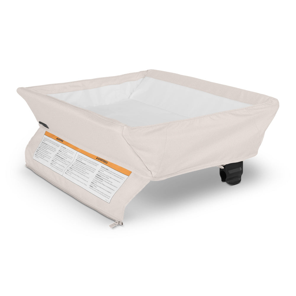 Uppababy changing station for Remi bassinet; beige fabric, white interior, caster wheels