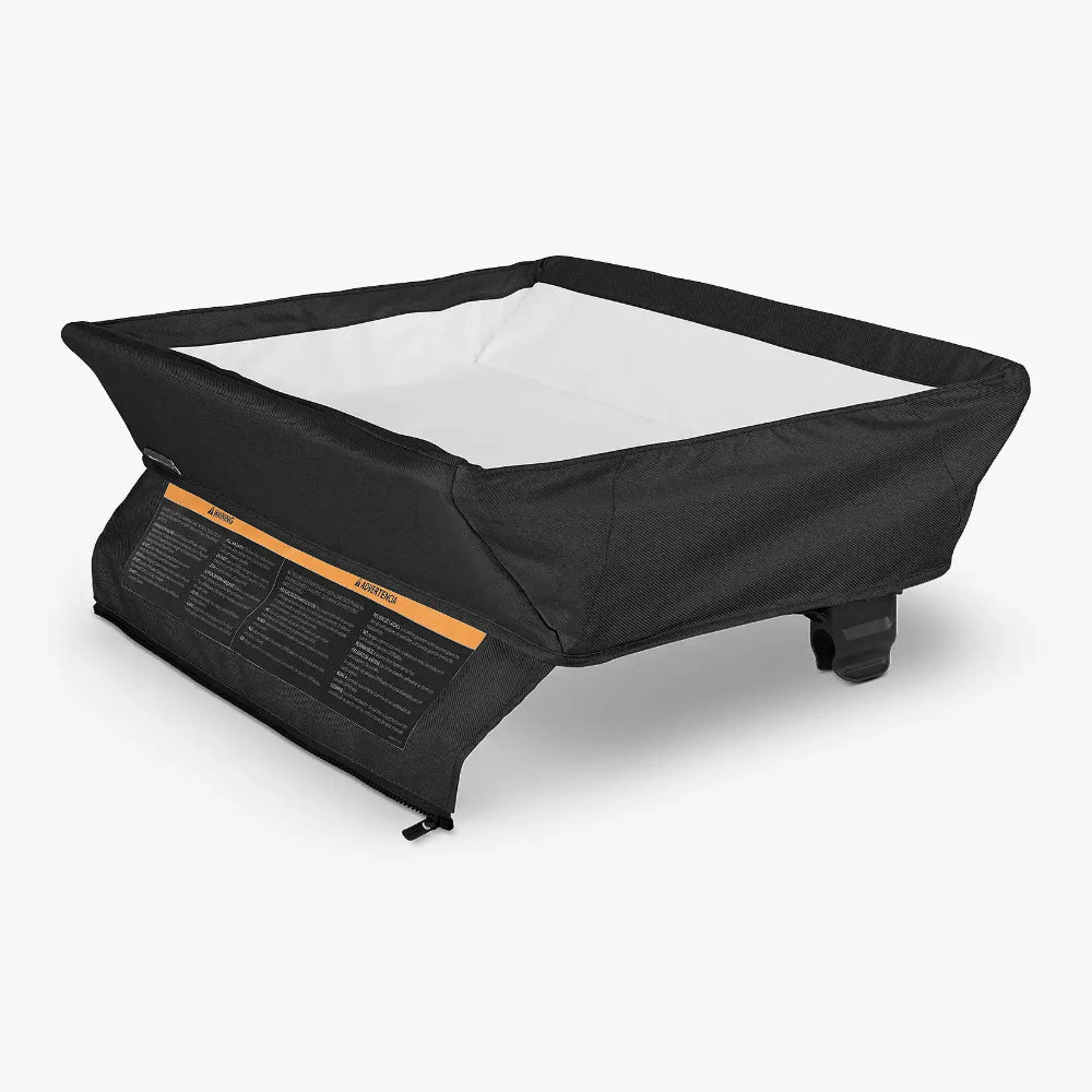 Uppababy changing station for Remi bassinet playard, black exterior with white interior liner