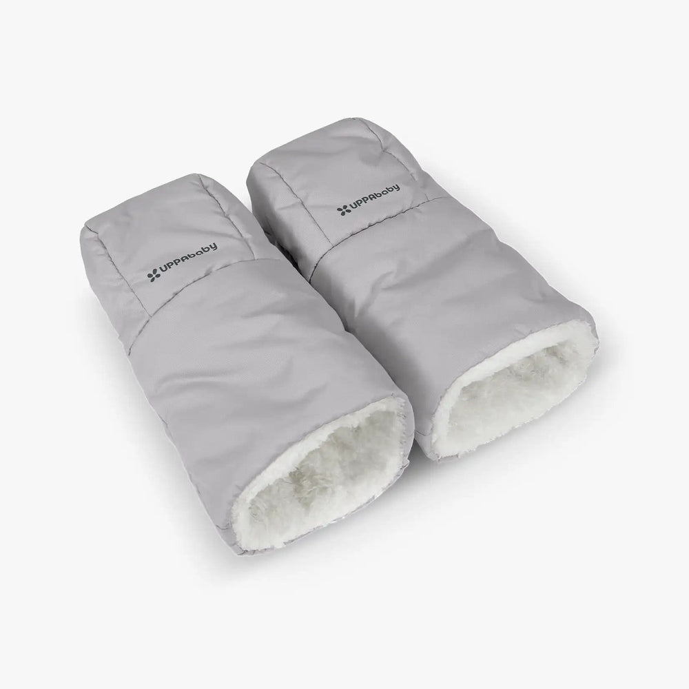 Uppababy Cozy Handmuffs, light gray with white fleece lining, set of 2, shown attached to stroller handles.