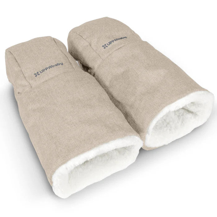 UPPABaby Cozy Handmuffs, beige with white fleece lining, pair shown ready to attach to a stroller for warm hands.
