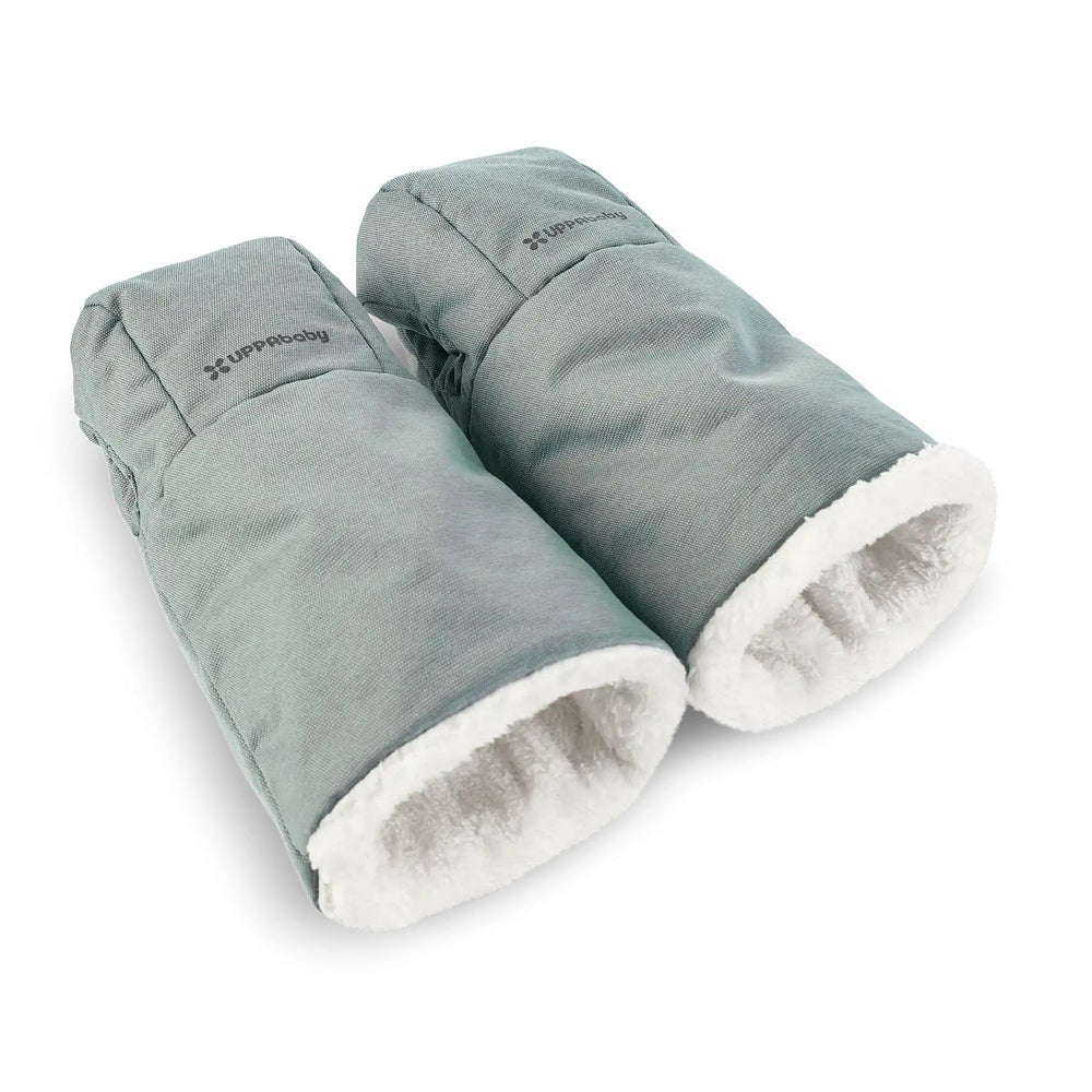 UPPABABY Cozy Handmuffs in teal with white fleece lining, attached to a stroller for warm hands.