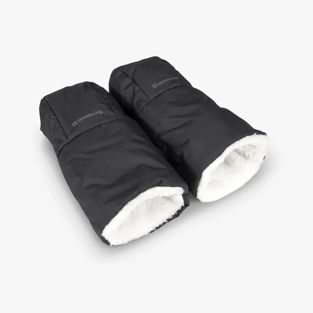 Uppababy Cozy Handmuffs in black with white faux-fur lining, shown laid flat to reveal plush interior.