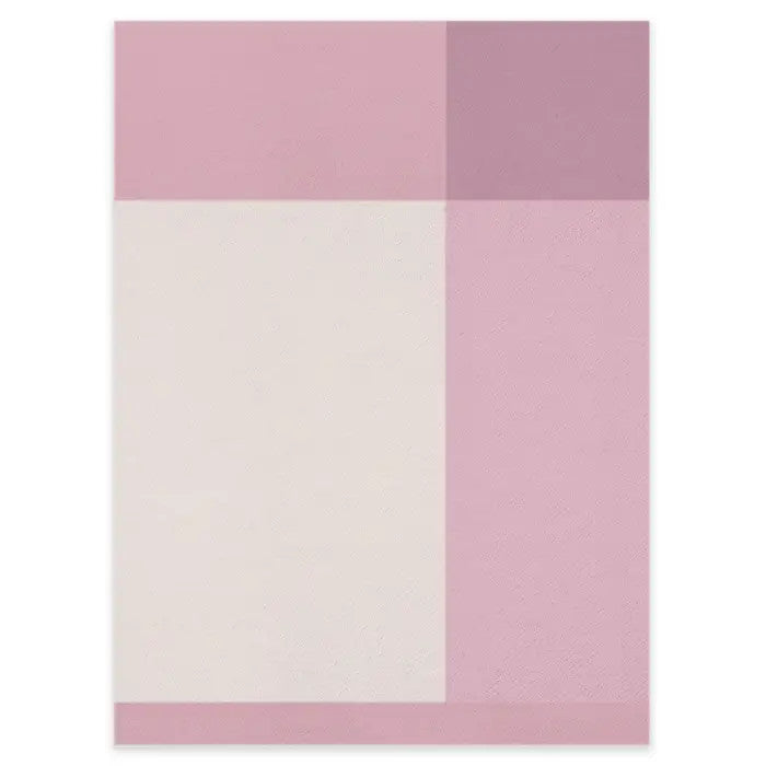 Uppababy Cozy Knit Blanket in soft pink knit with pastel color blocks laid flat to show texture.