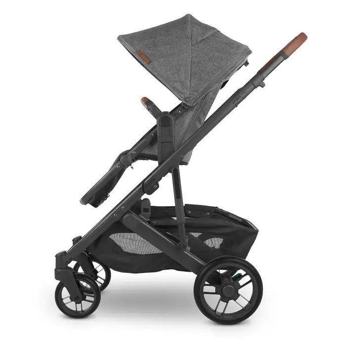 Uppababy Cruz V2 upper adapters on a gray-canopy stroller with black frame