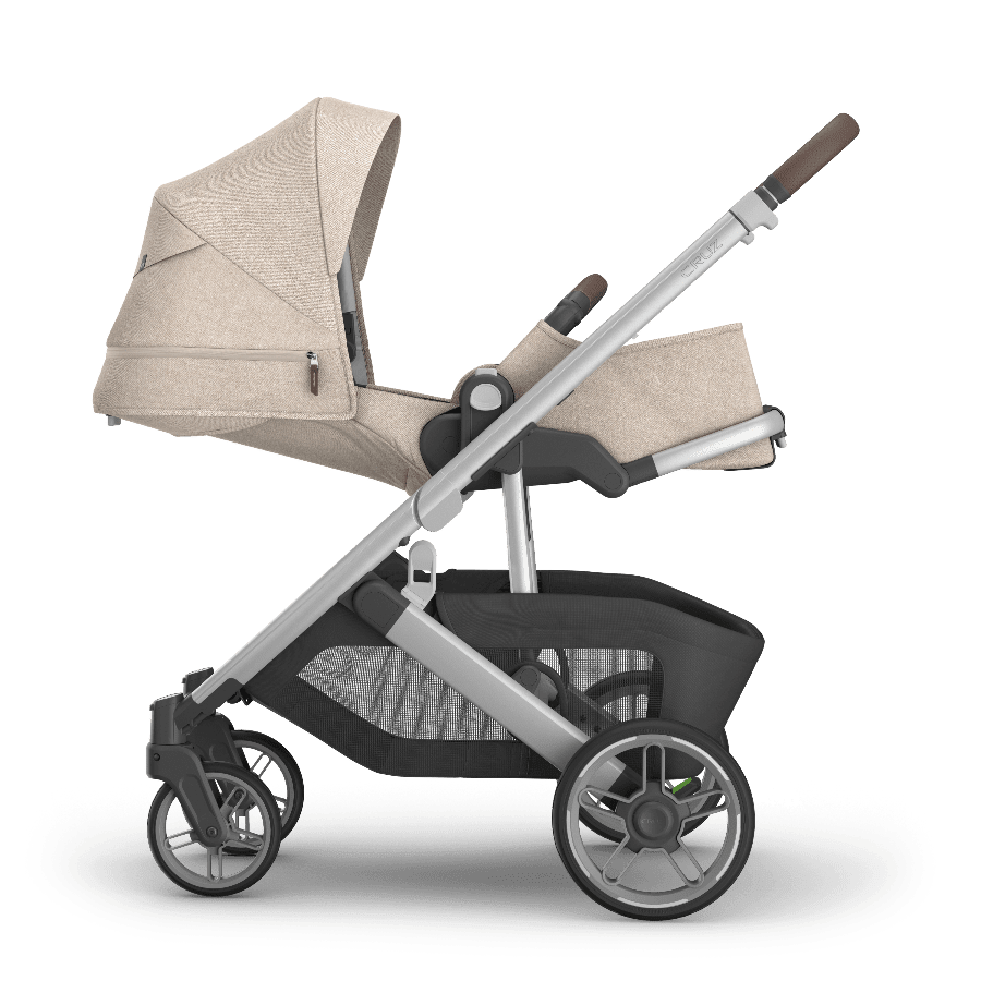 UPPABABY Cruz V3 stroller in beige fabric with silver frame and large storage basket